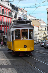 Plakat an old yellow tram in Lisbon, Portugal