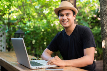 Young asian man working on laptop