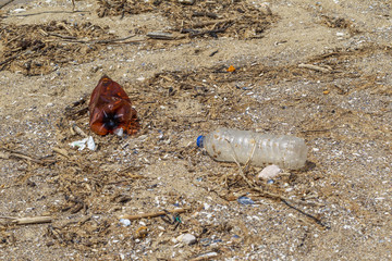 Conceptual: Disaster, Environmental problem - plastic trash. Spilled garbage on the beach of big...