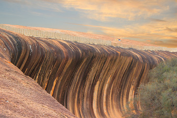 Huge rock formation (granite inselberg) shaped  like a breaking wave (Wave Rock, Hyden, Western Australia) © Ines Porada