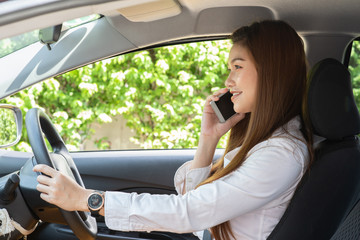 Beautiful attractive young woman smile in casual sitting in car talking in smartphone,Diving car with confident and happiness feeling,Happy transport concept