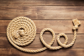 Obraz premium ship rope at wooden background texture
