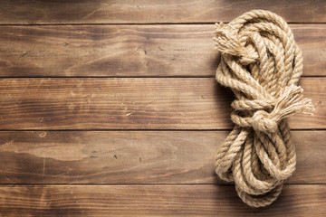Fototapeta na wymiar ship rope at wooden background texture