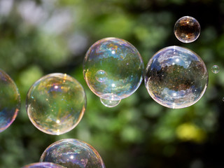 Abstract background with soap bubbles, close up, with reflection