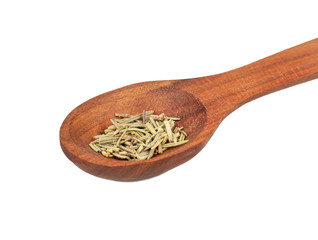 Dry rosemary in a spoon