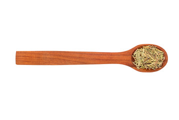 Dry rosemary in a spoon