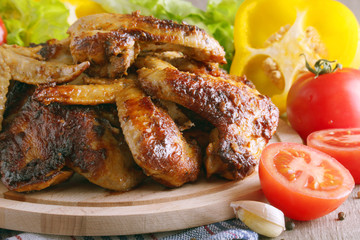 Chicken wings barbecue with different vegetables