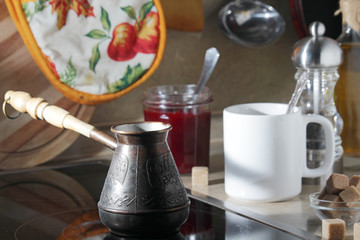 Morning still life with a coffee pot and a mug