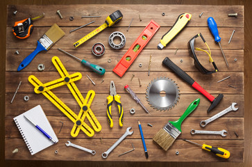 set of tools and instruments at wooden table