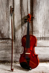 Fototapeta na wymiar old violin on vintage background