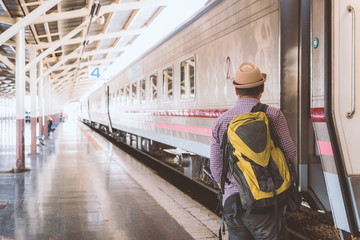 Young man standing at train station