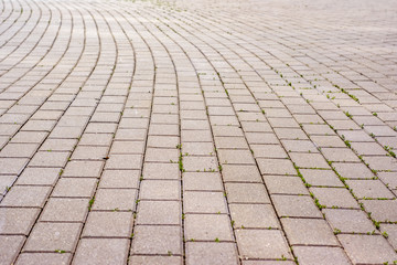 The surface is paved with road tiles.