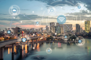 Smart city and wireless communication network concept. Digital network connection lines of Hanoi city at Hoang Cau lake. Hanoi cityscape by sunset period