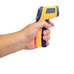 Yellow Infrared thermometer gun in hand used to measure temperature on white background.