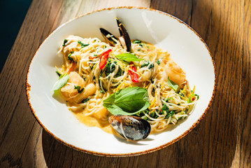 seafood pasta on the wooden background