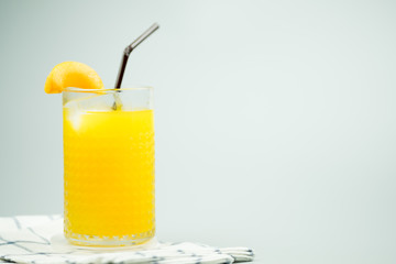 Freshly squeezed sweet orange juice and decoration with slice peach