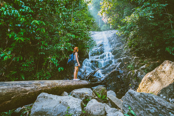 Women travel. woman asia travelers travel nature Forests, mountains, waterfalls. Travel Siliphum Waterfall at Chiangmai, in Thailand. travel Thailand.