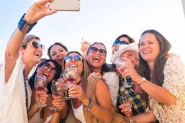Beautiful group of people women enjoying aperitif on the terrace celebrating a birthday and a...