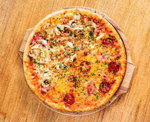 italian pizza on the wooden background
