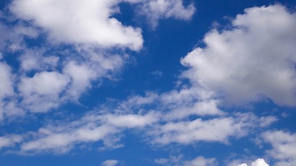 Fototapeta premium Blue sky and white clouds. Background for a sunshine day.