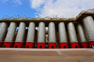 Storage tanks and pipes at alumina processing plant 
