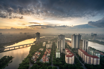 Obraz premium Aerial skyline view of Hanoi city, Vietnam. Hanoi cityscape by sunrise period at Linh Dam lake, Hoang Mai district