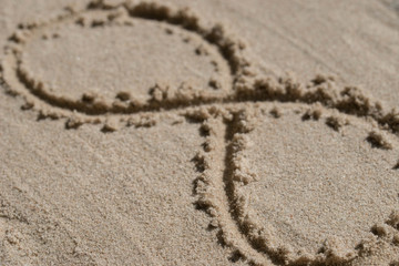 infinity symbol - drawing on sand