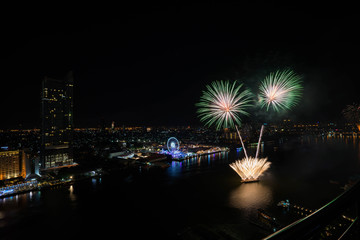 Colorful abstract new year firework on river side,bird eye view,Bangkok,Thailand,blur background