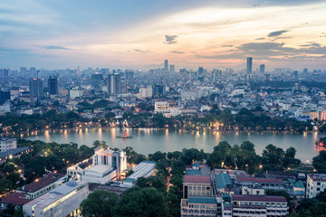 Aerial skyline view of Hoan Kiem lake or Ho Guom, Sword lake area at twilight. Hoan Kiem is center of Hanoi city. Hanoi cityscape.