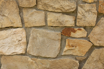 The wall is decorated with stone stones, beautiful texture.