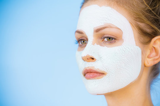 Girl with dry white mud mask on face