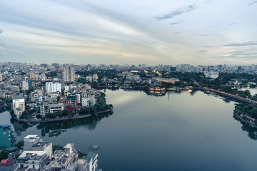 Naklejka premium Aerial view of Hanoi skyline at West Lake or Ho Tay. Hanoi cityscape at twilight