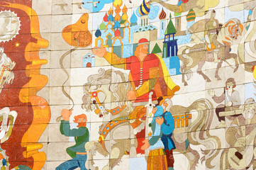 Obraz premium Fragment of large mosaic on inner side of Friendship Peoples Arch depicts folk stories from life of Russia and Georgia. Monument on Cross Pass of Georgian Military Highway