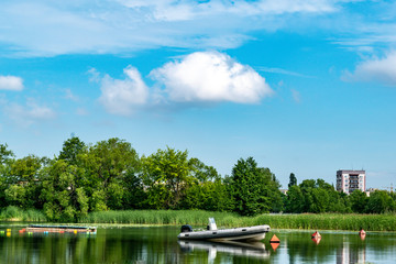 Fototapeta na wymiar Lonely boat standing near the river Bank