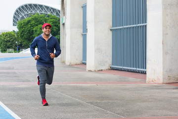 Man runner jogging in the city