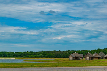 Holiday houses in the field near the lake