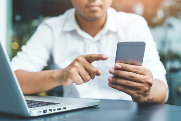 Close up hand man using smartphone