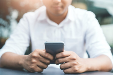 Close up hand man using smartphone
