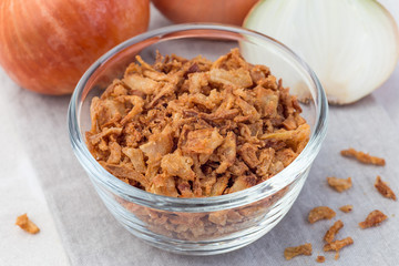 Fried onion in glass, topping for hot dog, fast food, horizontal, closeup
