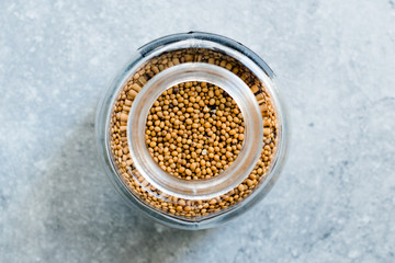 Organic Yellow Mustard Seeds in Glass Jar.