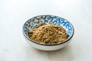Indian Garam Masala Powder in Small Traditional Porcelain Bowl.
