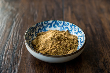 Indian Garam Masala Powder in Small Traditional Porcelain Bowl.