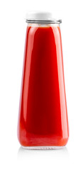 The Glass bottle of tomato juice isolated on white