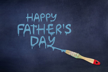 Happy father's day background. The inscription is painted on a blue background. Paintbrush.