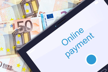 Concept Online Payments. Tablet on the background of Euro banknotes. Business. Finance.