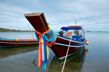 decorated thai traditional fishing boat on a tropical beach, Samui island Thailand