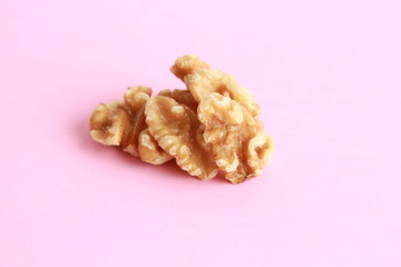 Peeled walnuts in colorful background