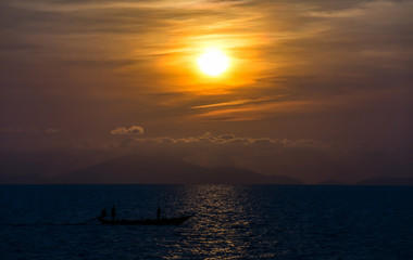 Sunrise with Sea and long tail boat with Silhouette light