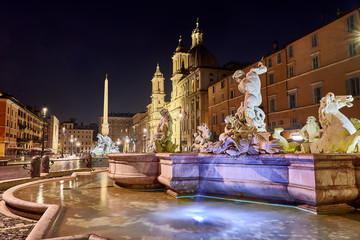 fountain in piazza navona by night, rome