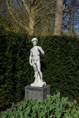 Fototapeta premium Flower garden, Netherlands , a statue of a tree